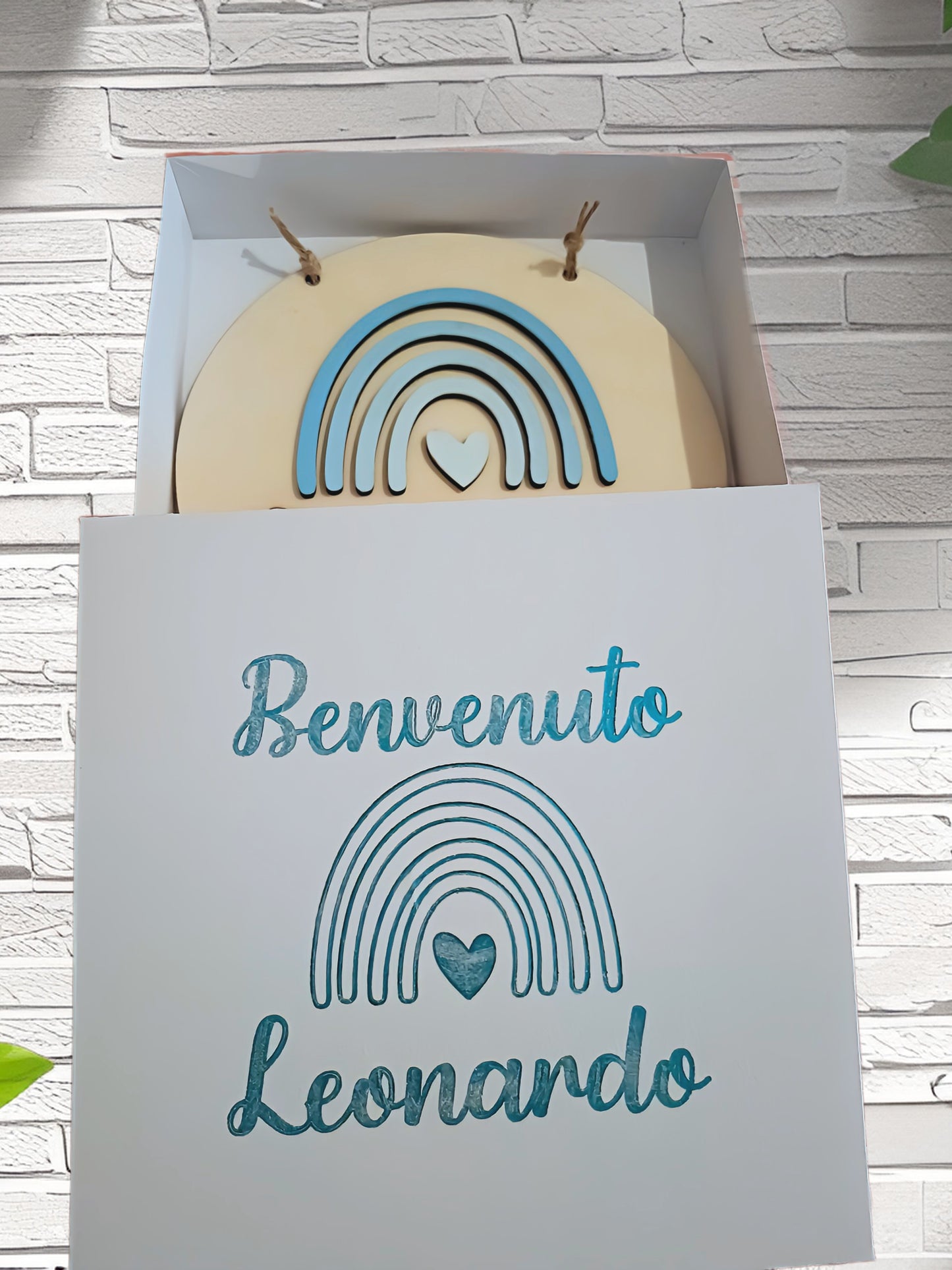 Welcome baby gift box with 'Benvenuto Leonardo', blue rainbow and heart design.