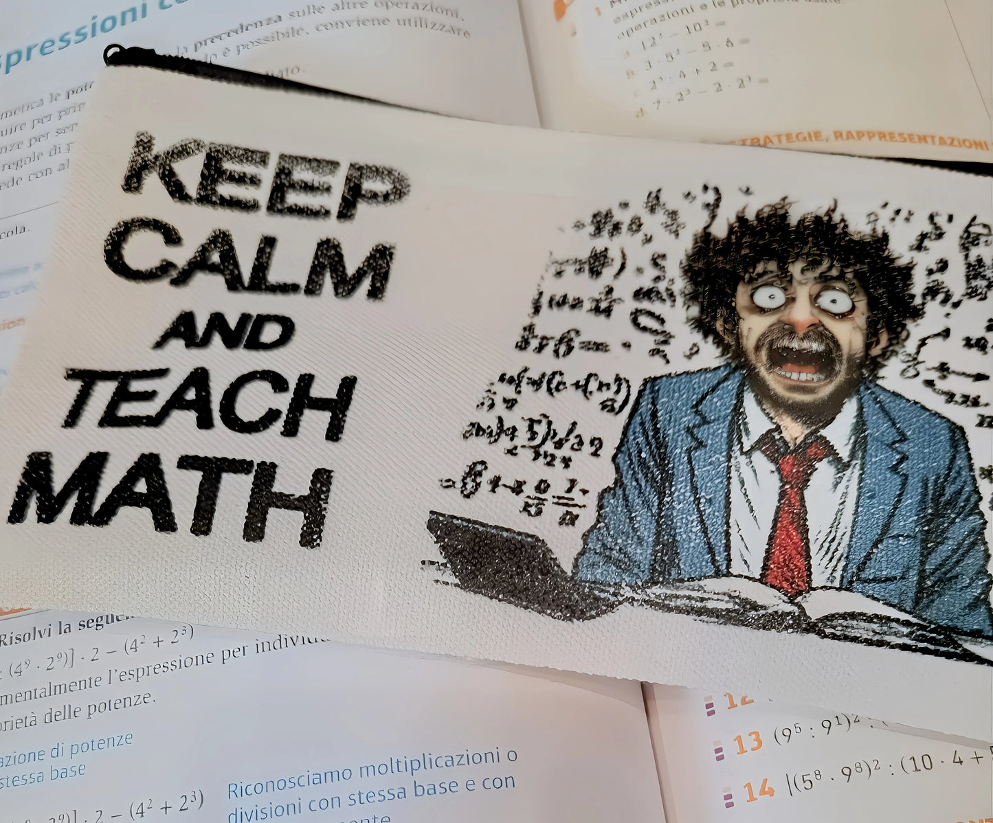 Keep Calm and Teach Math pouch with stressed cartoon teacher, math formulas, on open textbooks