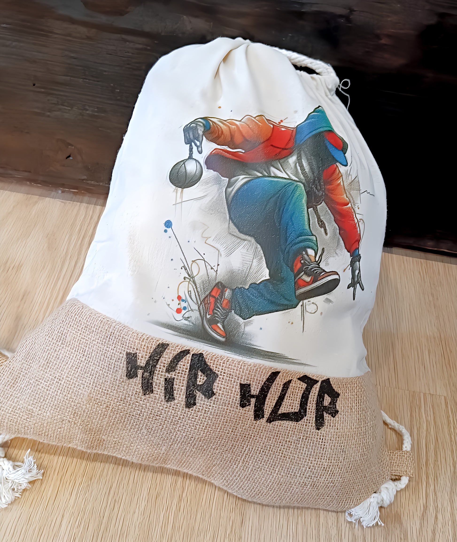 Hip hop style drawstring bag with graffiti dancer illustration and burlap bottom