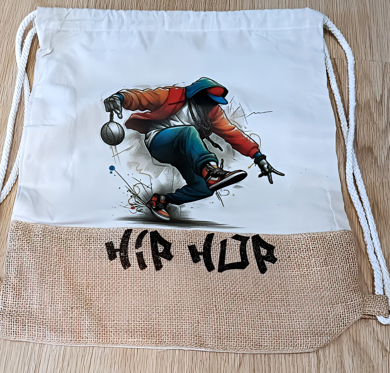 Hip hop drawstring bag with graffiti dancer and basketball on wood floor