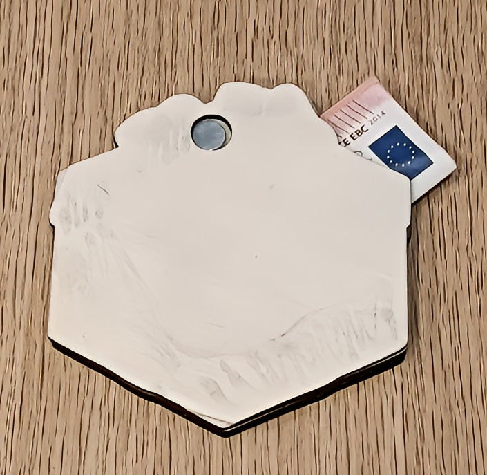 White hexagonal wallet holder with euro banknote on wooden table