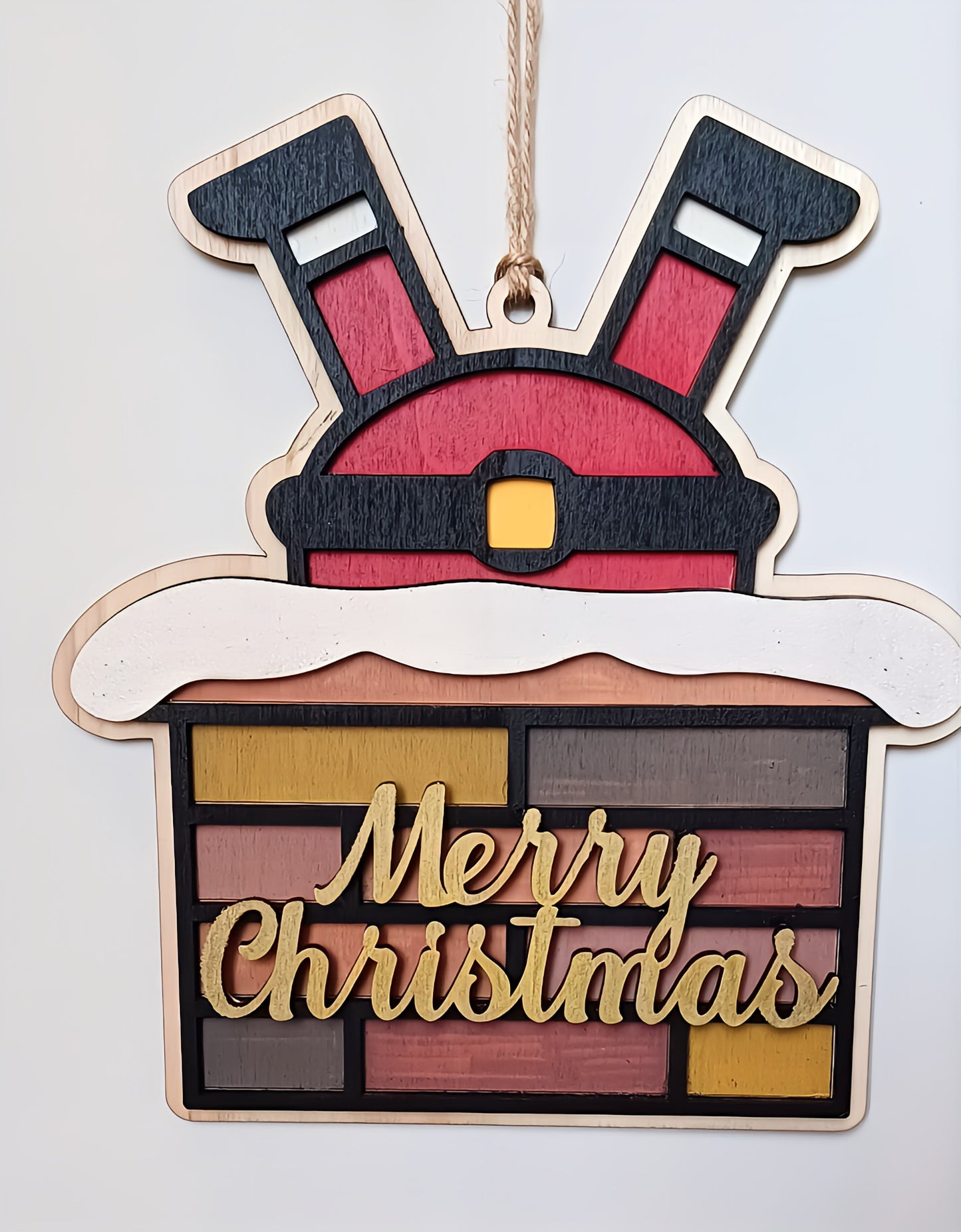 Wooden Merry Christmas sign with Santa legs in a brick chimney ornament