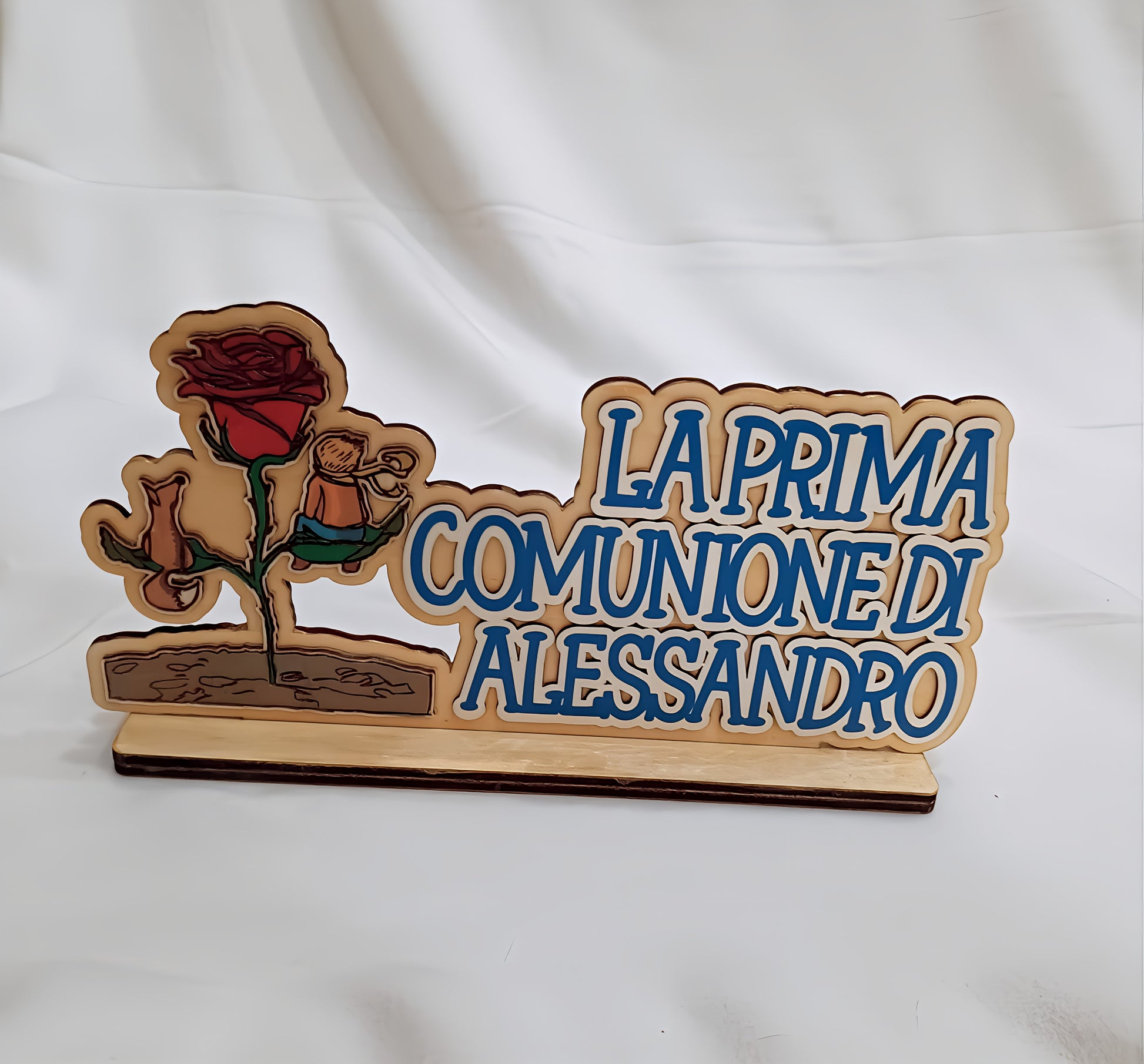 Wooden plaque for first communion with rose and Italian inscription on white background