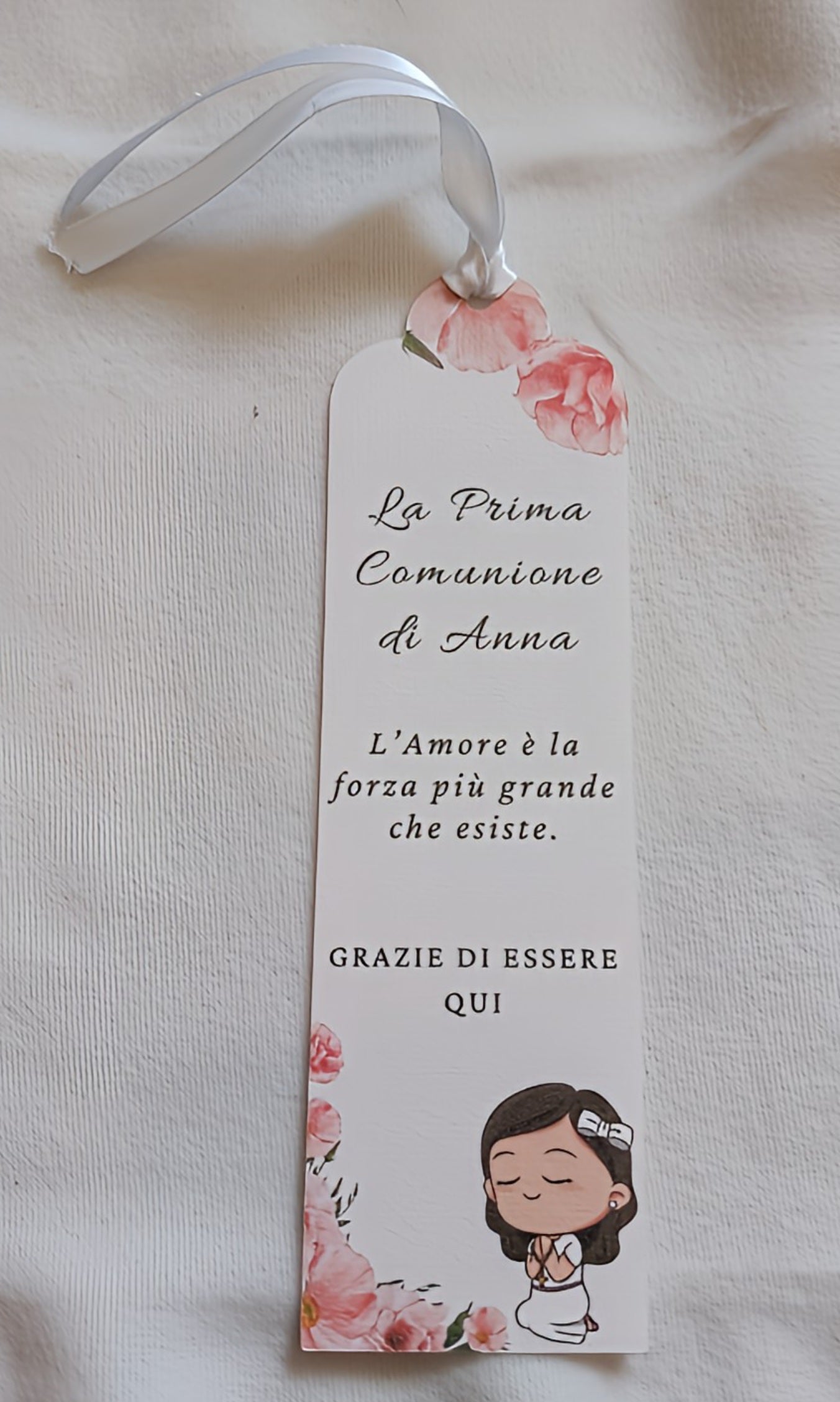 Italian First Communion bookmark with pink flowers, a white ribbon, and praying girl illustration
