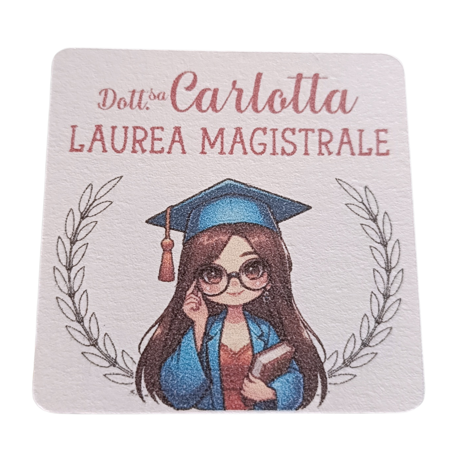 Cartoon girl in graduation gown and cap holding book, laurea magistrale text, laurel branches